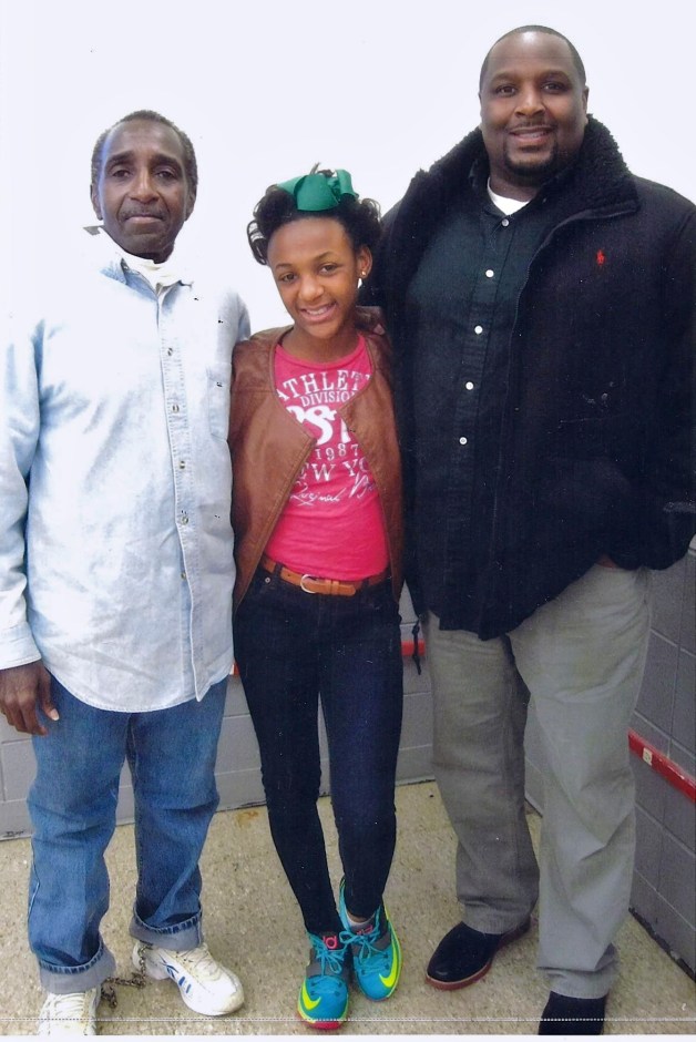 Zulu with his granddaughter and his son